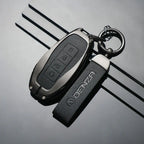 DENZA car key fob with leather keychain, sleek black design for EV accessories