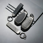 DENZA car key fob with leather cover and matching keychain, sleek EV accessory design