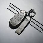 Mercedes-Benz key fob with sleek metal cover and keychain, premium EV accessory