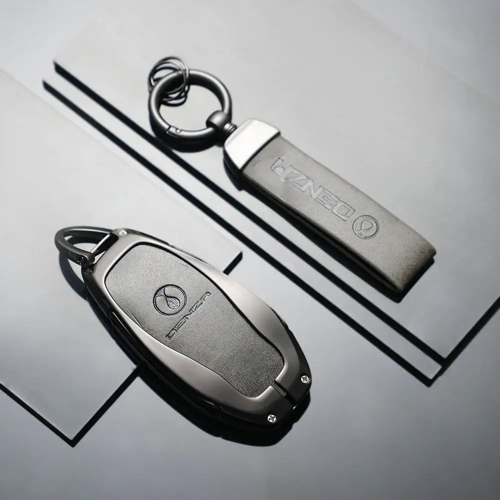DENZA car key fob and keychain with sleek metallic finish, premium EV accessory