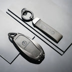 DENZA car key fob and keychain with sleek metallic finish, premium EV accessory